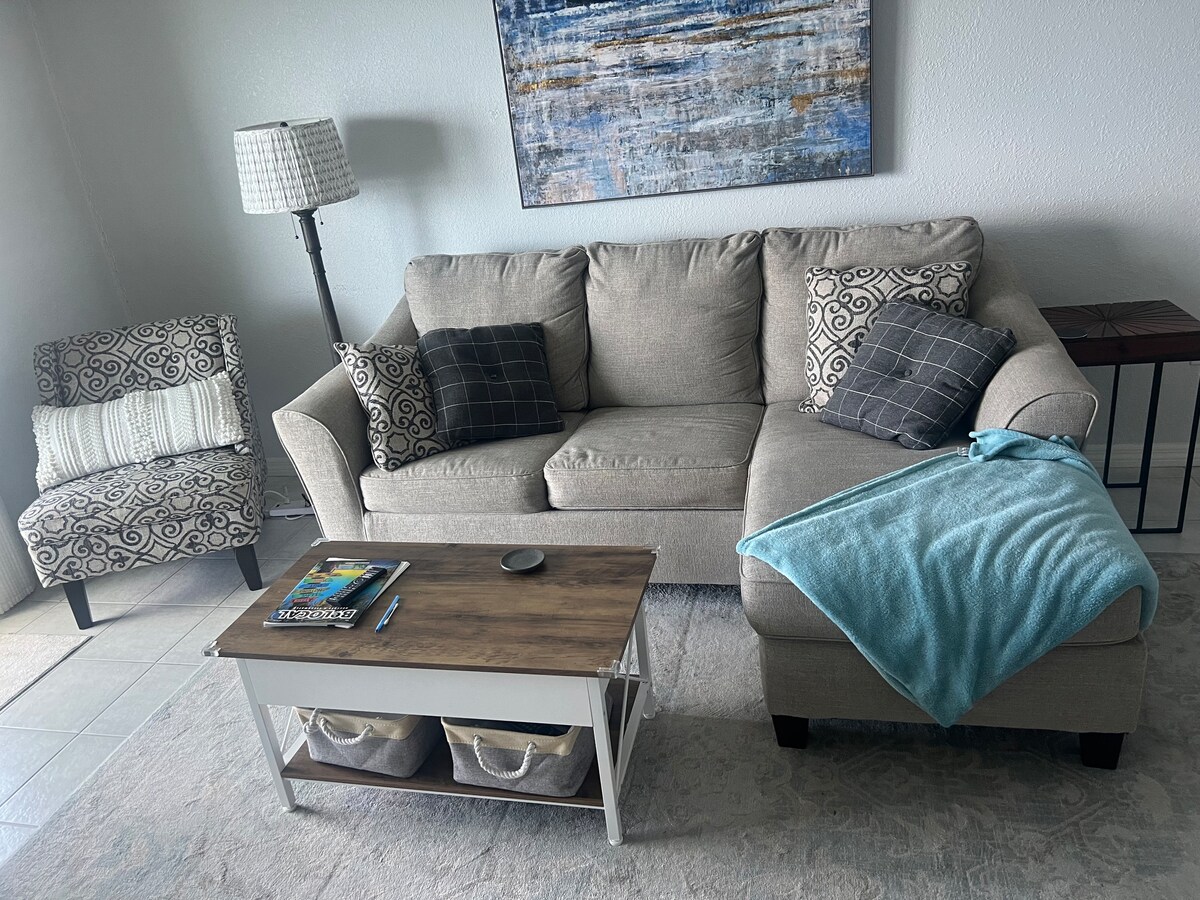 Living room with Murphy bed and balcony access